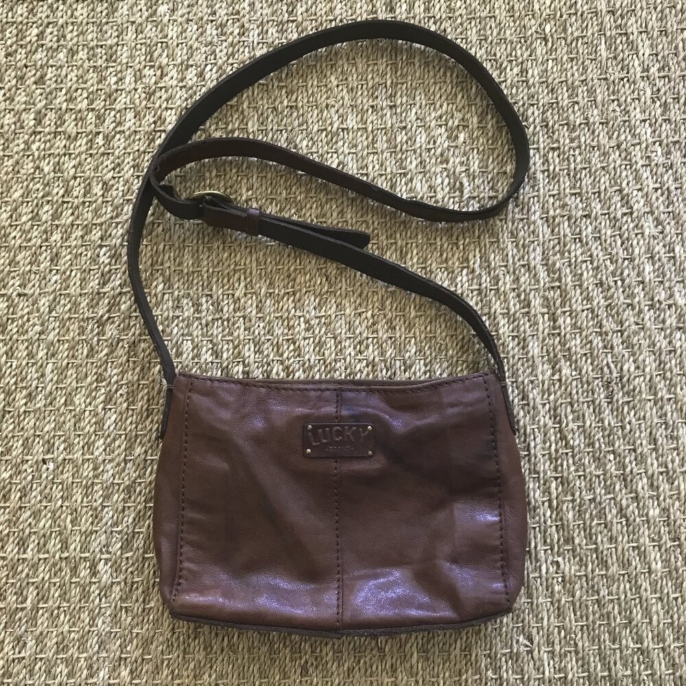 Lucky Brand Lamb Leather Mini Crossbody Bag with gold tone studs and clover